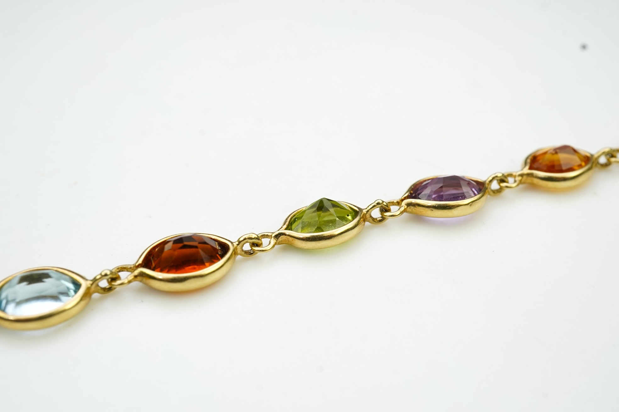 A gold and gem-set bracelet